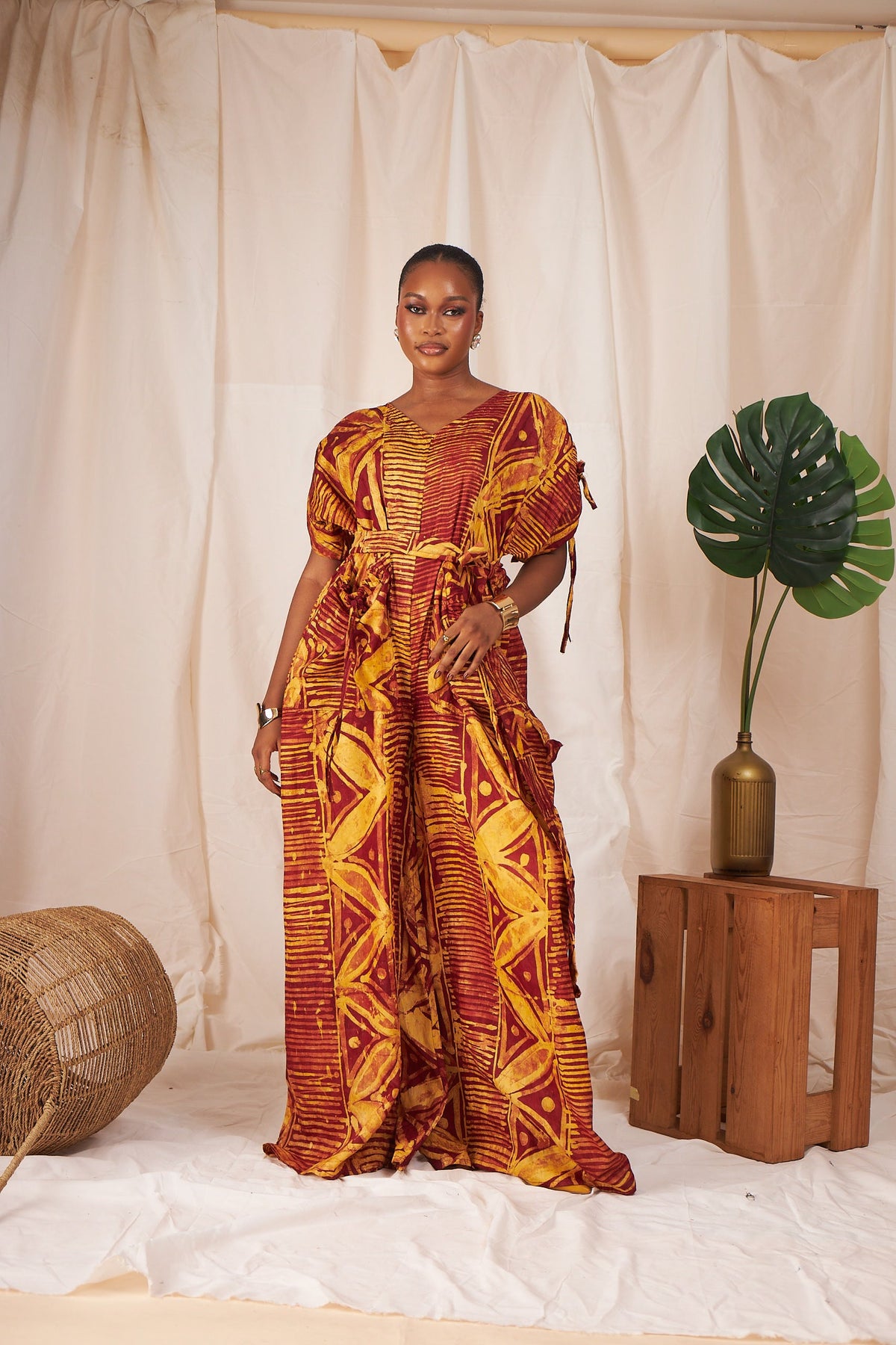 Ama Batik wide-leg jumpsuit in rust and gold