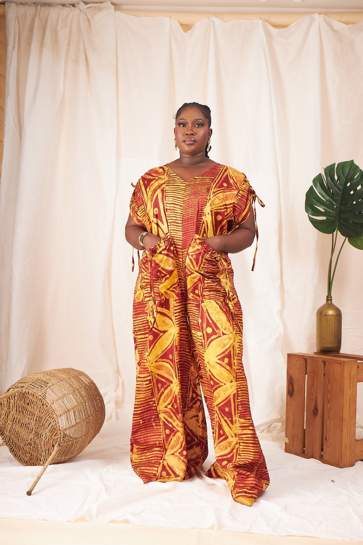 Ama Batik wide-leg jumpsuit in rust and gold