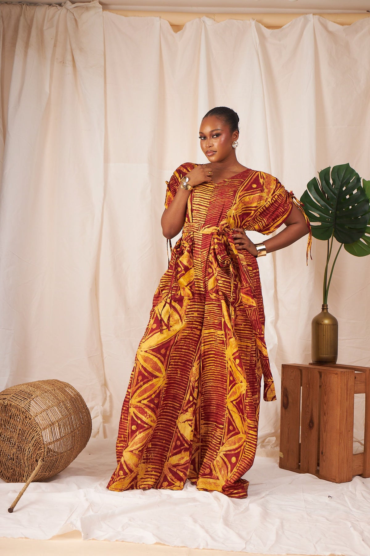 Ama Batik wide-leg jumpsuit in rust and gold